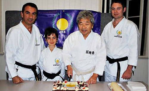 Sensei Katsunori Kanaya cuts cake with Hamid and David Mostofizadeh and head instructor Andrew Quinn. Sensei Katsunori Kanaya cuts cake with Hamid and David Mostofizadeh and head instructor Andrew Quinn.